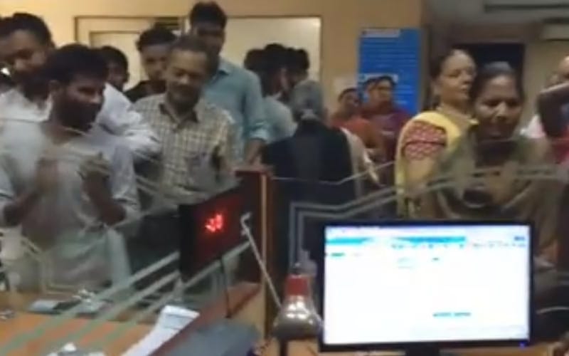  old lady gave flowers to state bank staff in lucknow