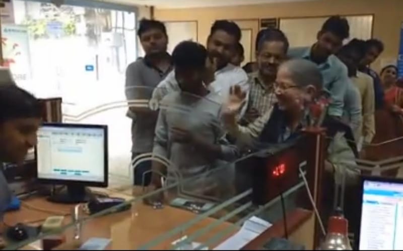  old lady gave flowers to state bank staff in lucknow