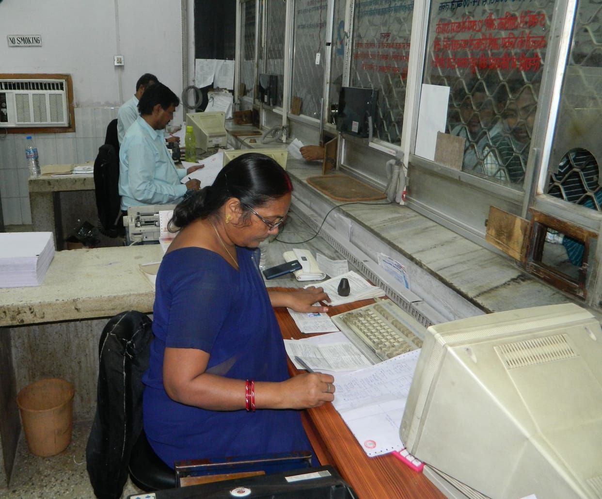 Passengers fill up the details of notes