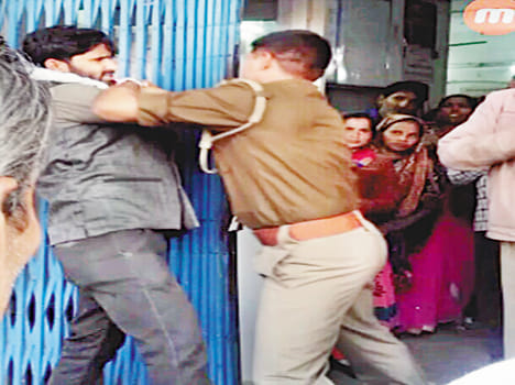 beaten by police during withdrawal money to bank for mother treatment 