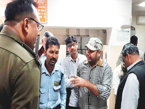 Two youths riot police scuffle