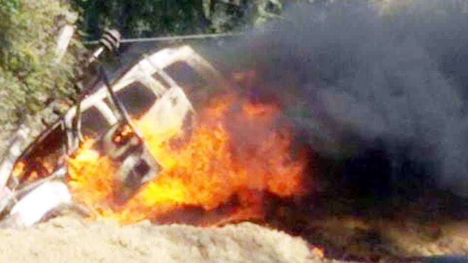 burnt car after collision with high tension line
