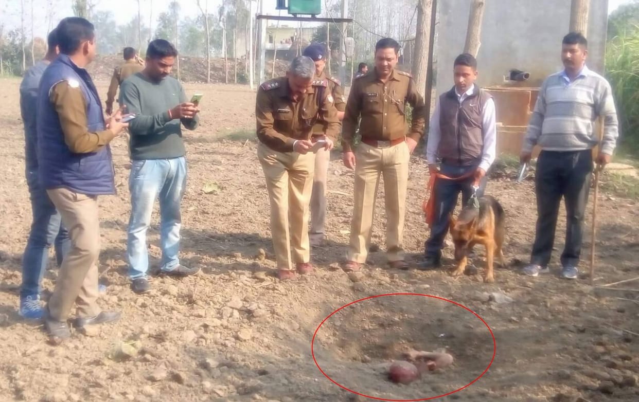 child dead body found buried in field.