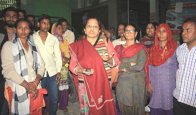 women storm out of the bank