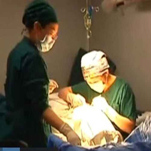 Woman grows breasts on her belly