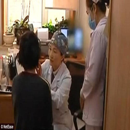 Woman grows breasts on her belly