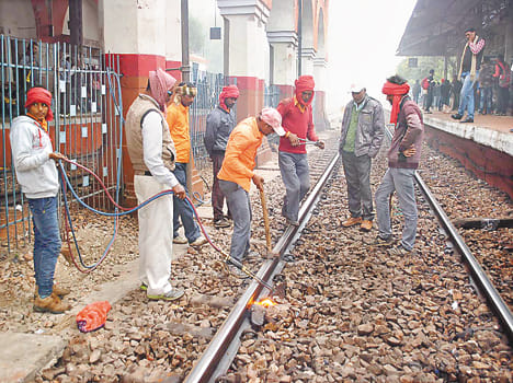 railway worker showing awareness for track 