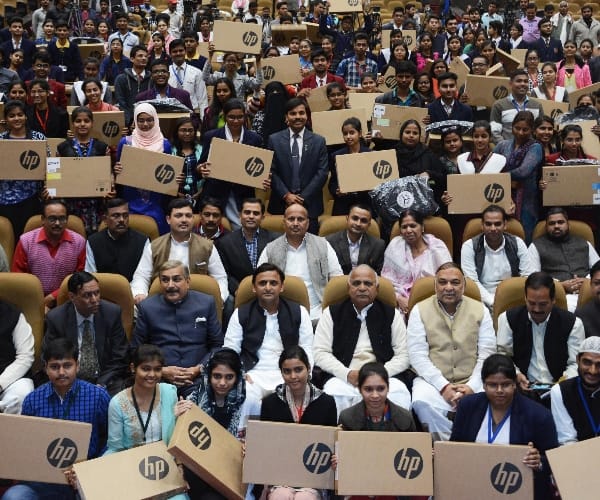  Akhilesh Yadav distributes laptops to students.