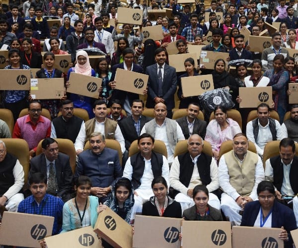  Akhilesh Yadav distributes laptops to students.
