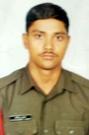 The soldier was shot and killed inside the house