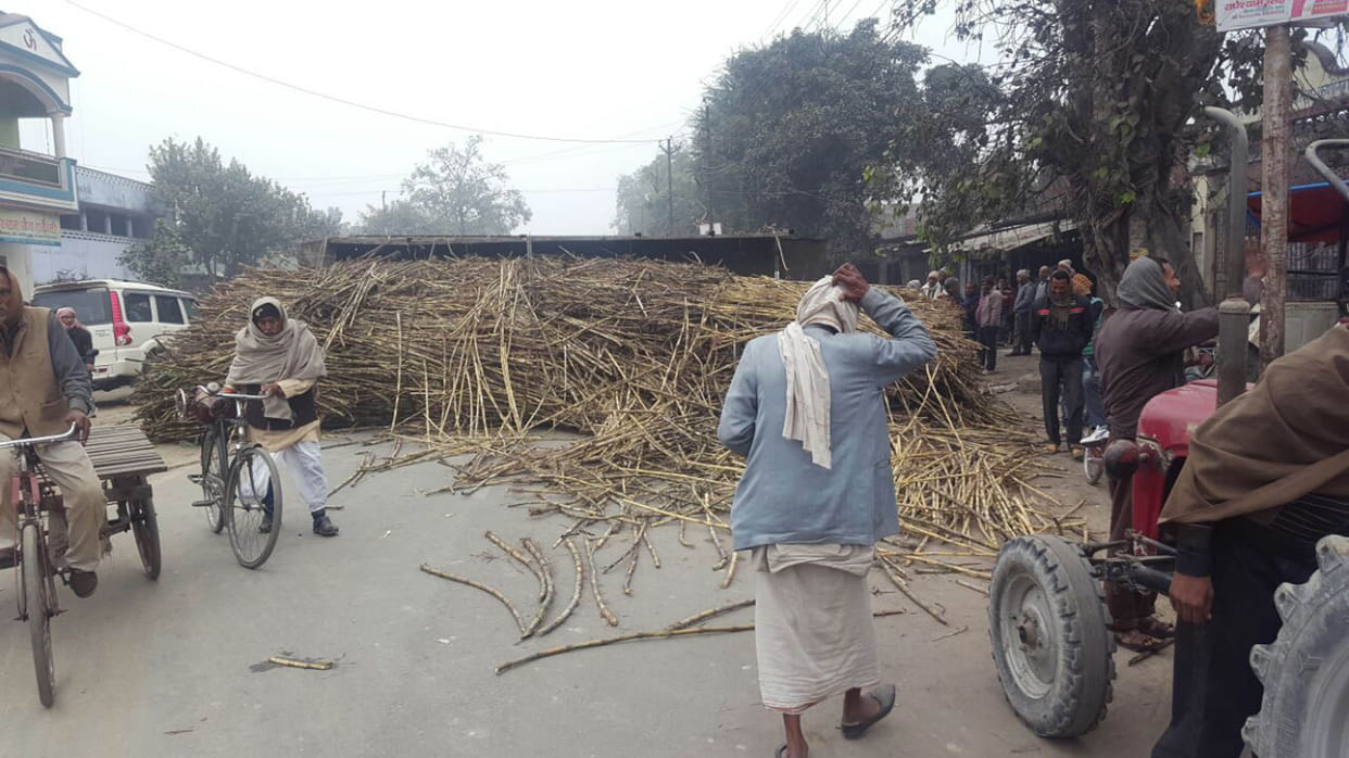 U-turn on the main route overloaded trolley laden cane