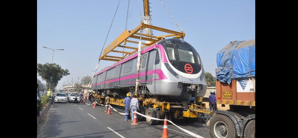 magenta metro coach from crane to track