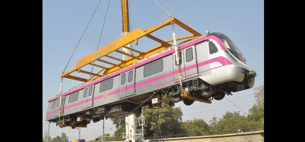 magenta metro coach from crane to track