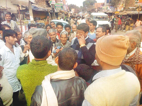 Villagers supply inspector hoop on the street