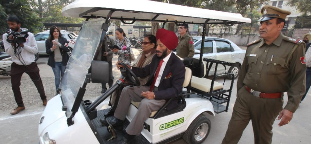 Between his posters Flying Sikh Milkha Singh arrived to vote