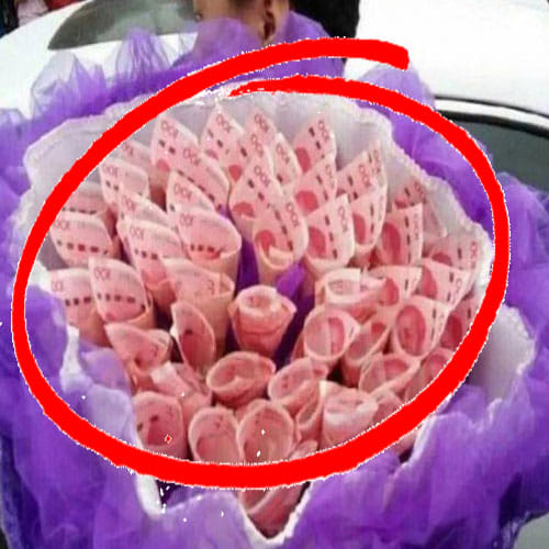man proposes girlfriend with a bouquet made of currency