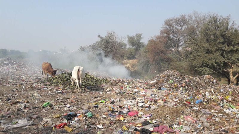 Smoke rises from the municipality dump house