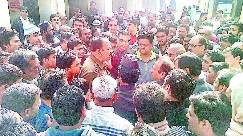 Besieged the police station in-charge