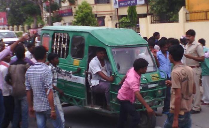 auto drivers beat policeman publicly
