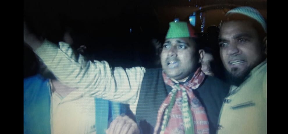 sp district president climbs water tank and warns, take back akhilesh or i will jump