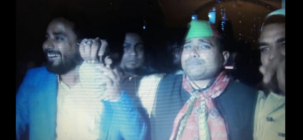 sp district president climbs water tank and warns, take back akhilesh or i will jump