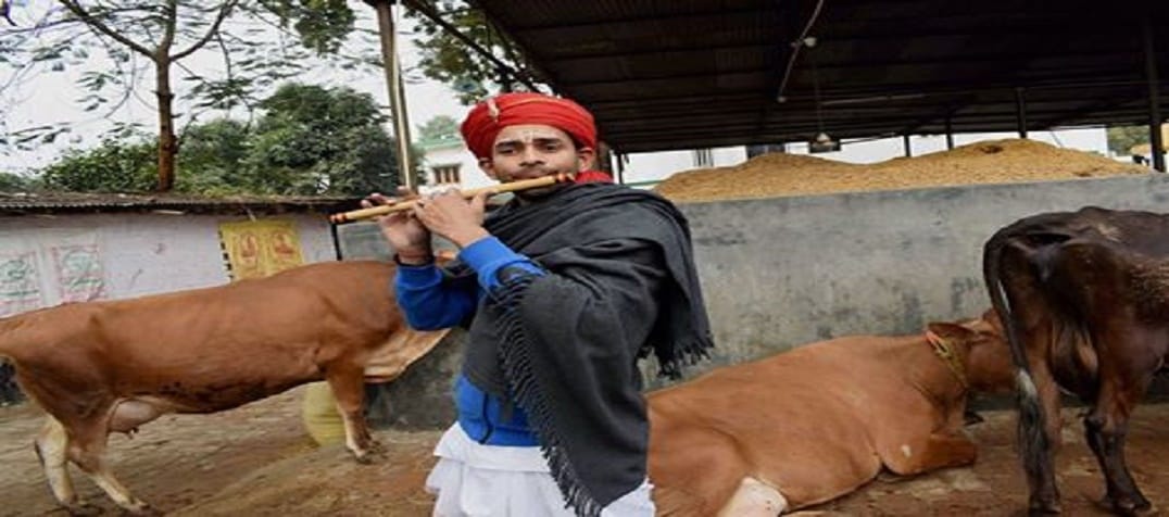 son of RJD Chief Lalu Yadav, Tej Pratap Yadav plays flute dressed as Krishna