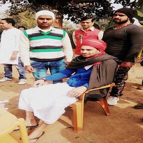 son of RJD Chief Lalu Yadav, Tej Pratap Yadav plays flute dressed as Krishna