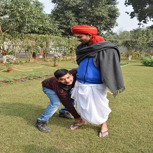 son of RJD Chief Lalu Yadav, Tej Pratap Yadav plays flute dressed as Krishna