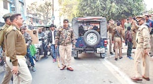New Year woman, manipulating poles stick out fiercely, rumor of communal tension
