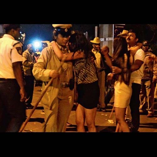 sources says women molested in Bengaluru in front of police