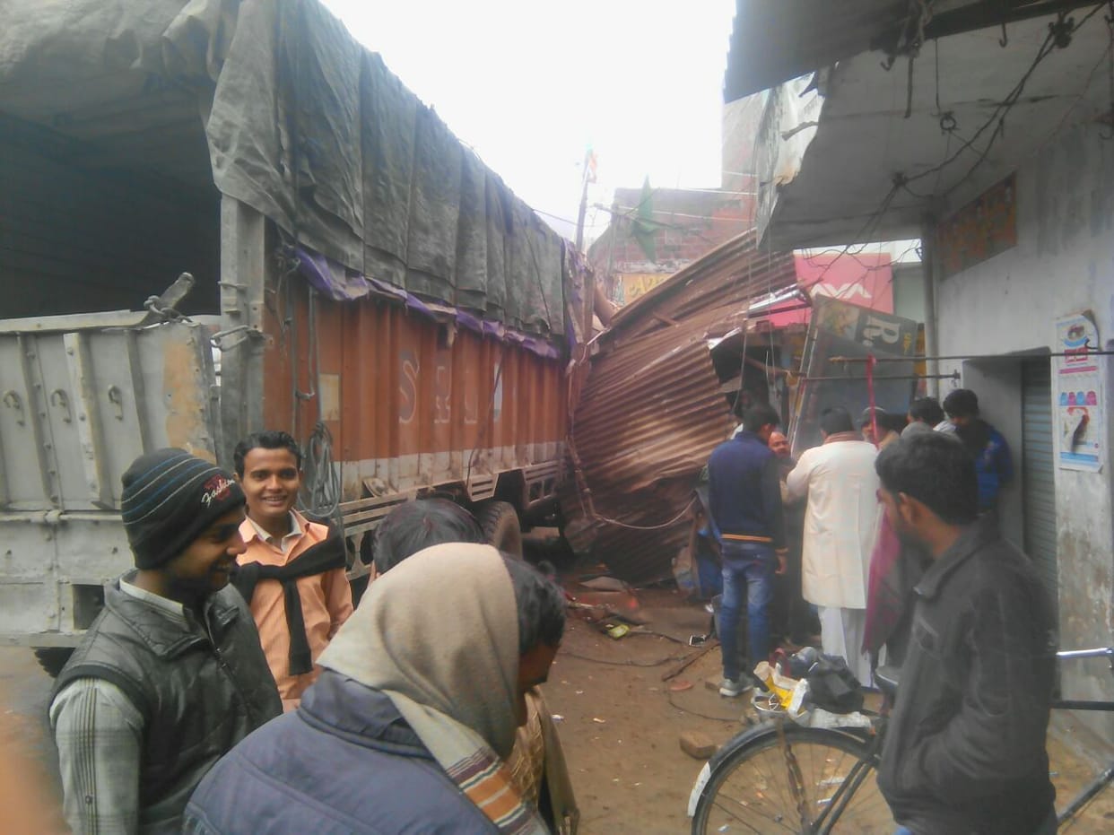 Woman killed in collision of trucks