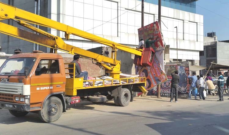 Hoardings, banners were brought late night