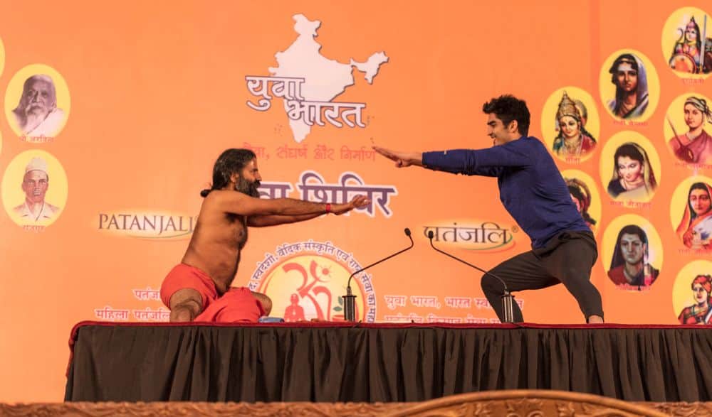 boxer vijender doing yoga with baba ramdev