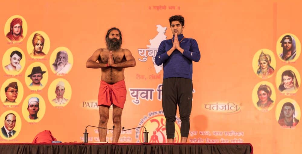 boxer vijender doing yoga with baba ramdev