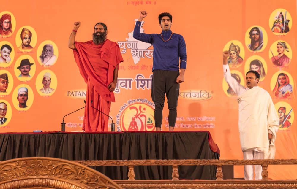 boxer vijender doing yoga with baba ramdev