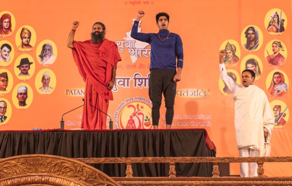 boxer vijender doing yoga with baba ramdev