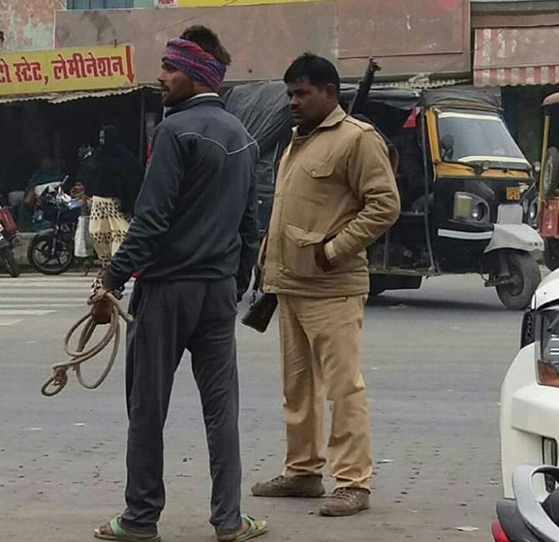 Hands handcuffed prisoner is handed over