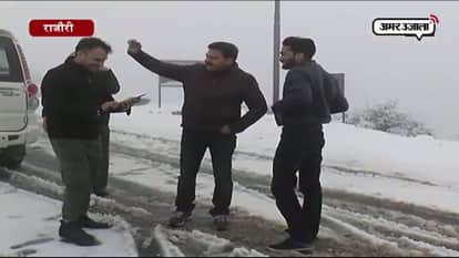Tourists having fun with snowfall in rajouri