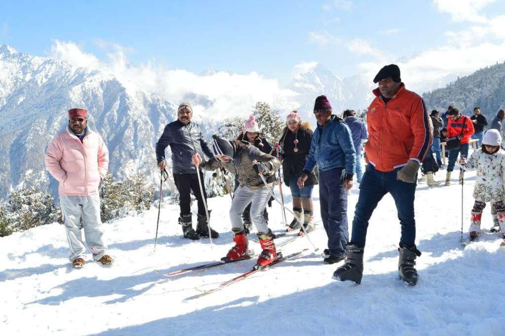tourist enjoying skiing in auli.