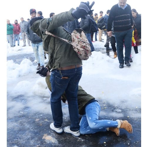 slipping and sliding on snow in queen of the hills shimla