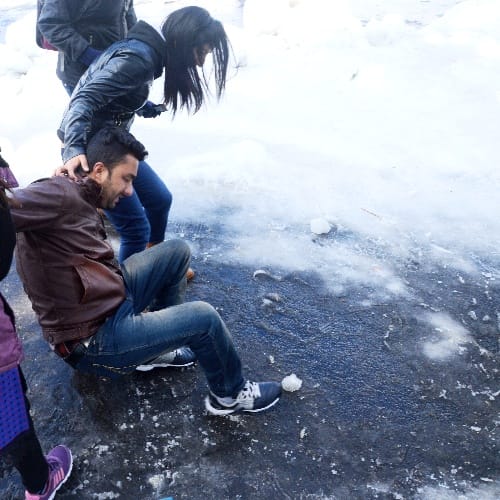 slipping and sliding on snow in queen of the hills shimla