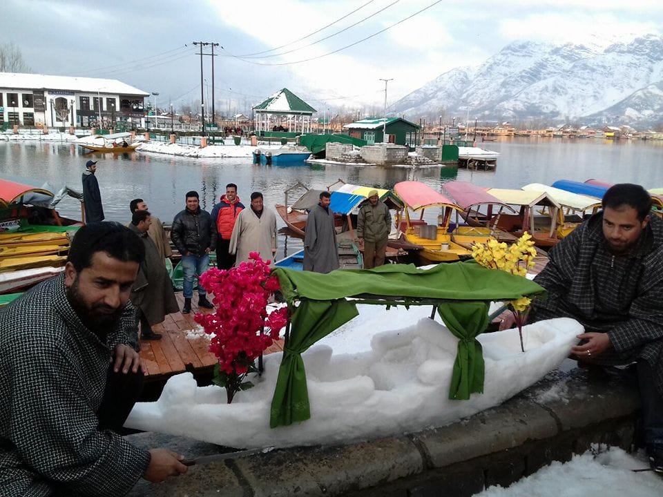 TOURISTS MAKING FUN WITH SNOWMAN IN KASHMIR