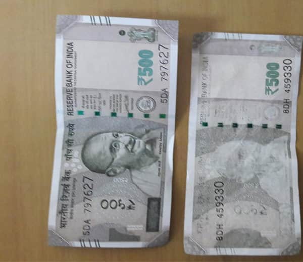 500 note colour faded and mahatma gandhi missed after fell down in water, bank refused to change