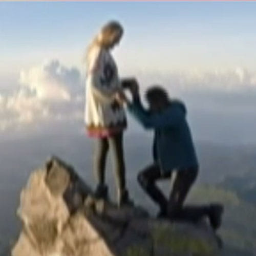 boyfriend propose his girlfriend at the top of volcano