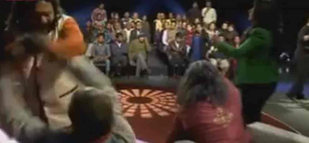 assaulting on swami om with the audience in the channel program