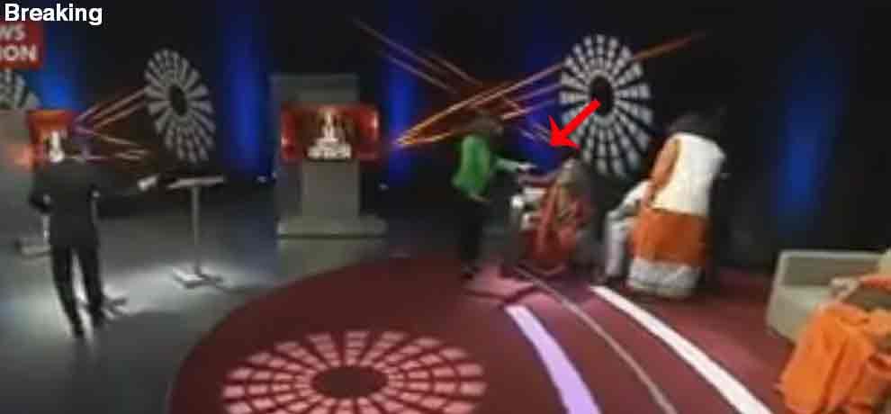 assaulting on swami om with the audience in the channel program