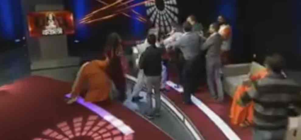 assaulting on swami om with the audience in the channel program