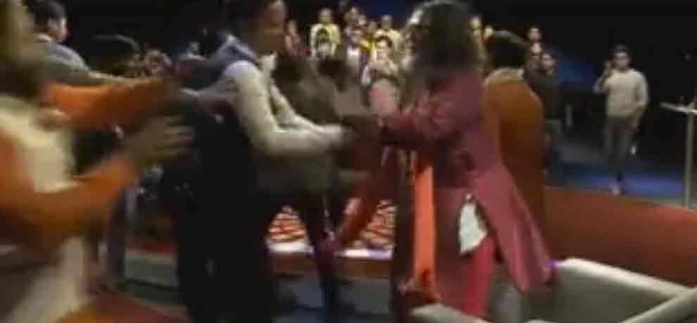 assaulting on swami om with the audience in the channel program