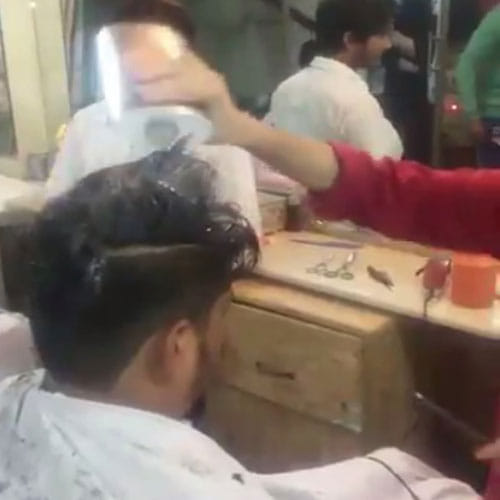 Barber In Pakistan Lights Hair On Fire To Give New Look