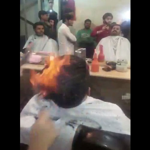 Barber In Pakistan Lights Hair On Fire To Give New Look